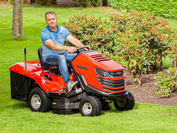 Man mowing on new Duke™ lawn tractor with collector