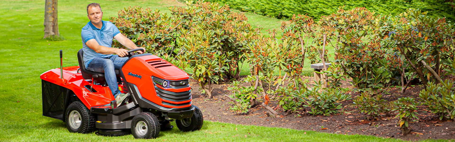 Man mowing on new Duke™ lawn tractor with collector