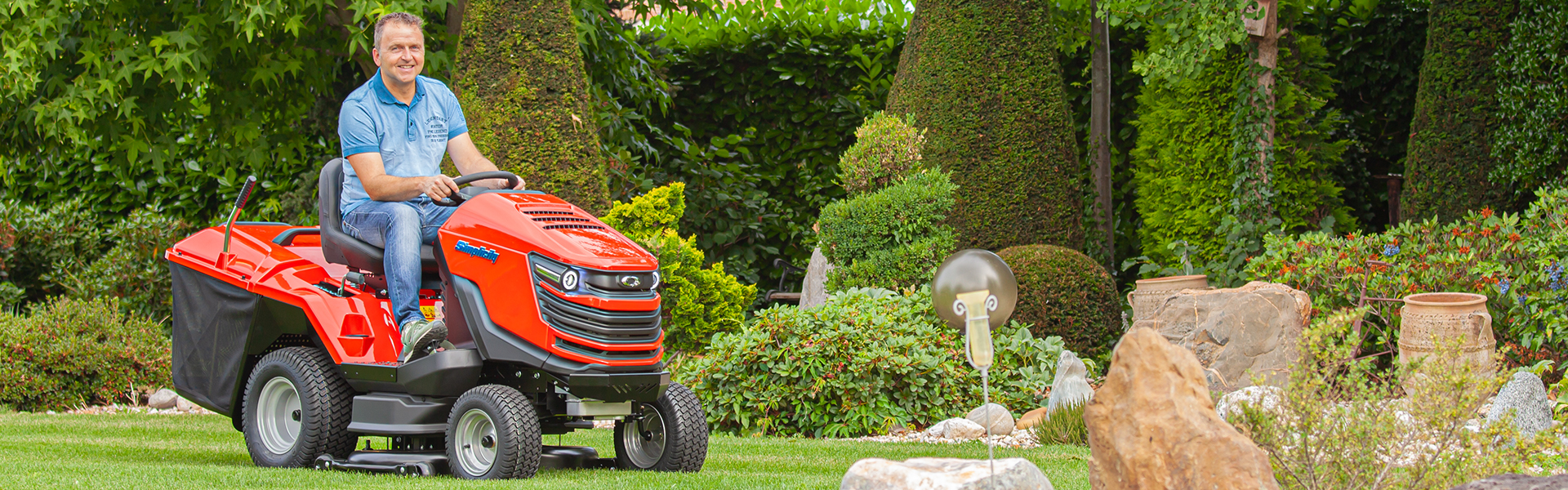 Man mowing on new Duke™ lawn tractor with collector