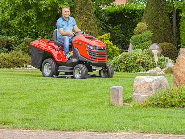 Man mowing on new Duke™ lawn tractor with collector