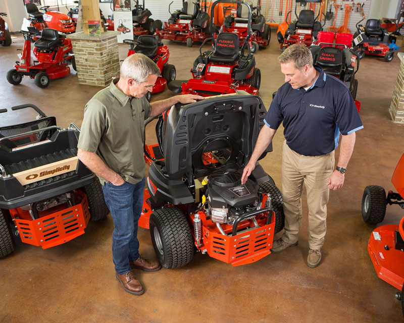 Simplicity dealer showing customer a Simplicity zero turn mower