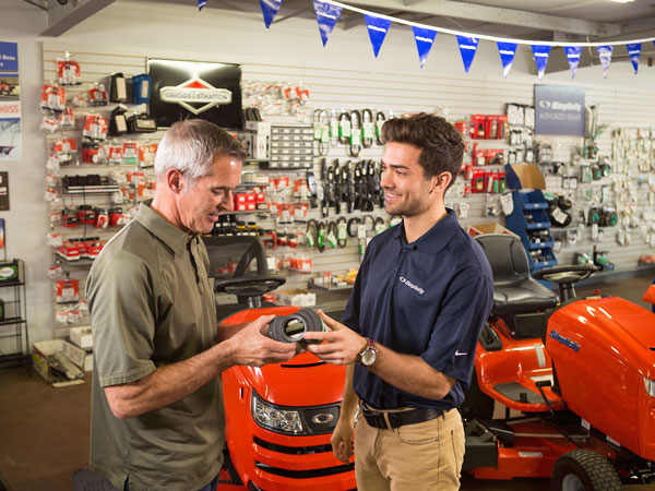 Dealer showing customer a Simplicity part in dealership