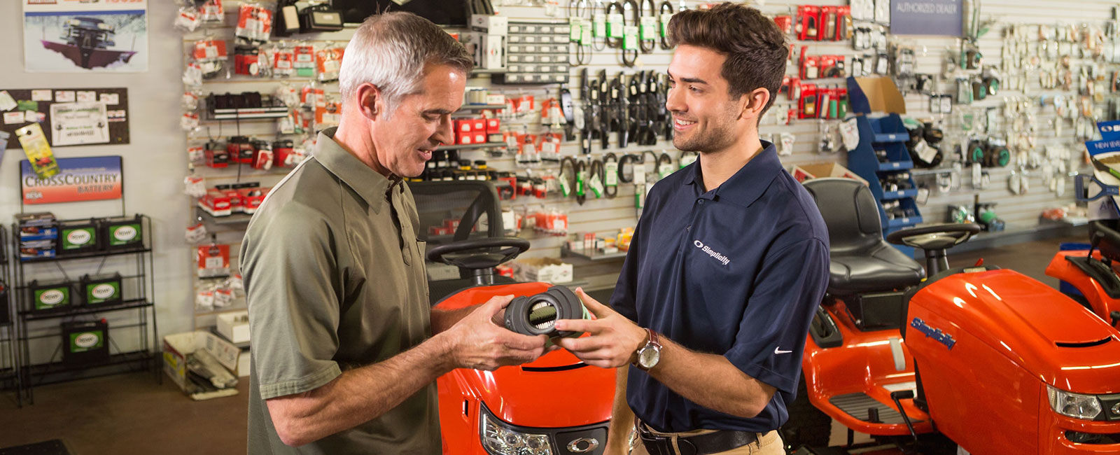 Dealer showing customer a Simplicity part in dealership